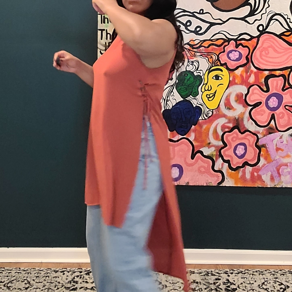 Sleeveless summer top with tie-up side slits